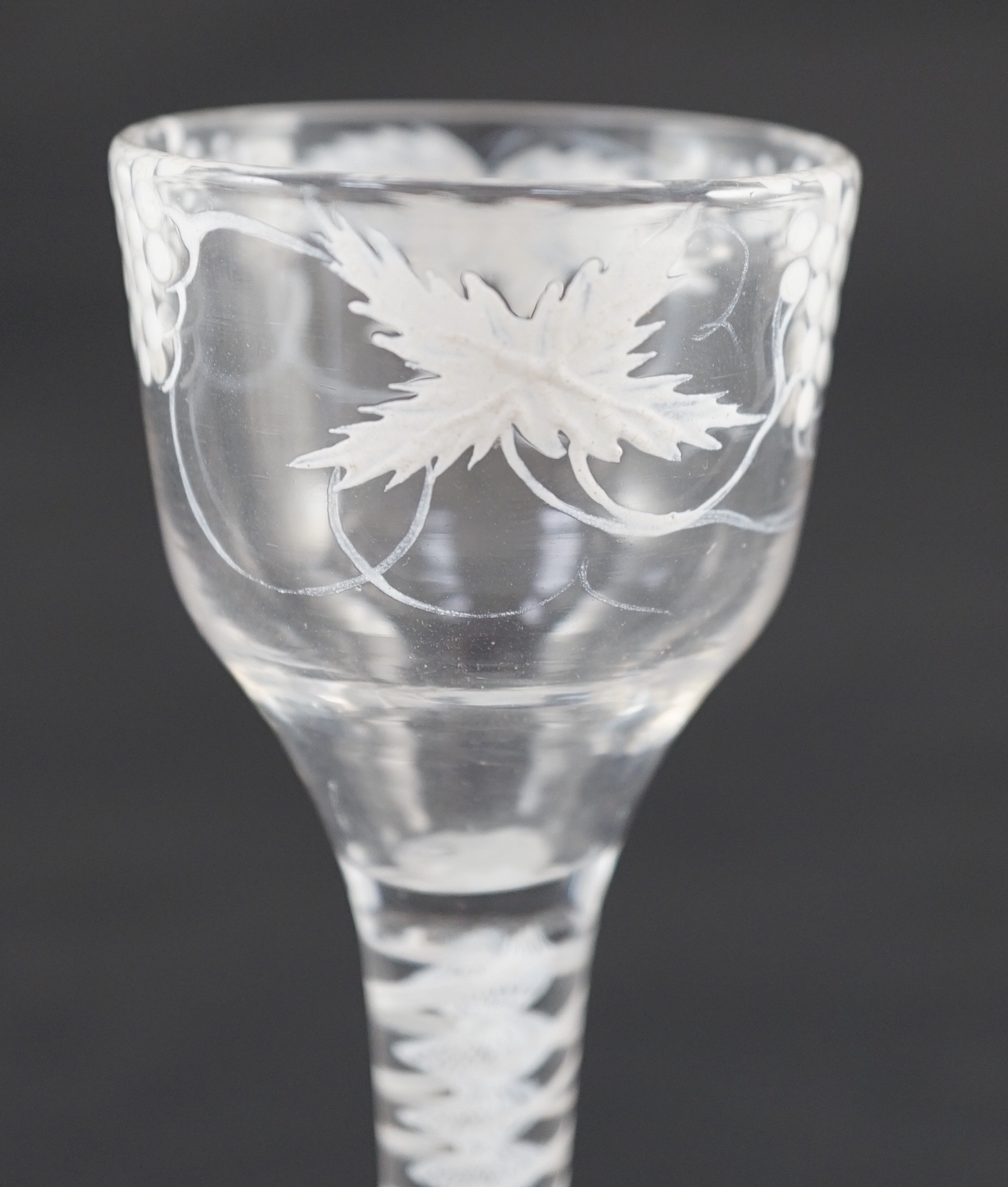 A Beilby enamelled wine glass, c.1765, 14cm high, rim reduced